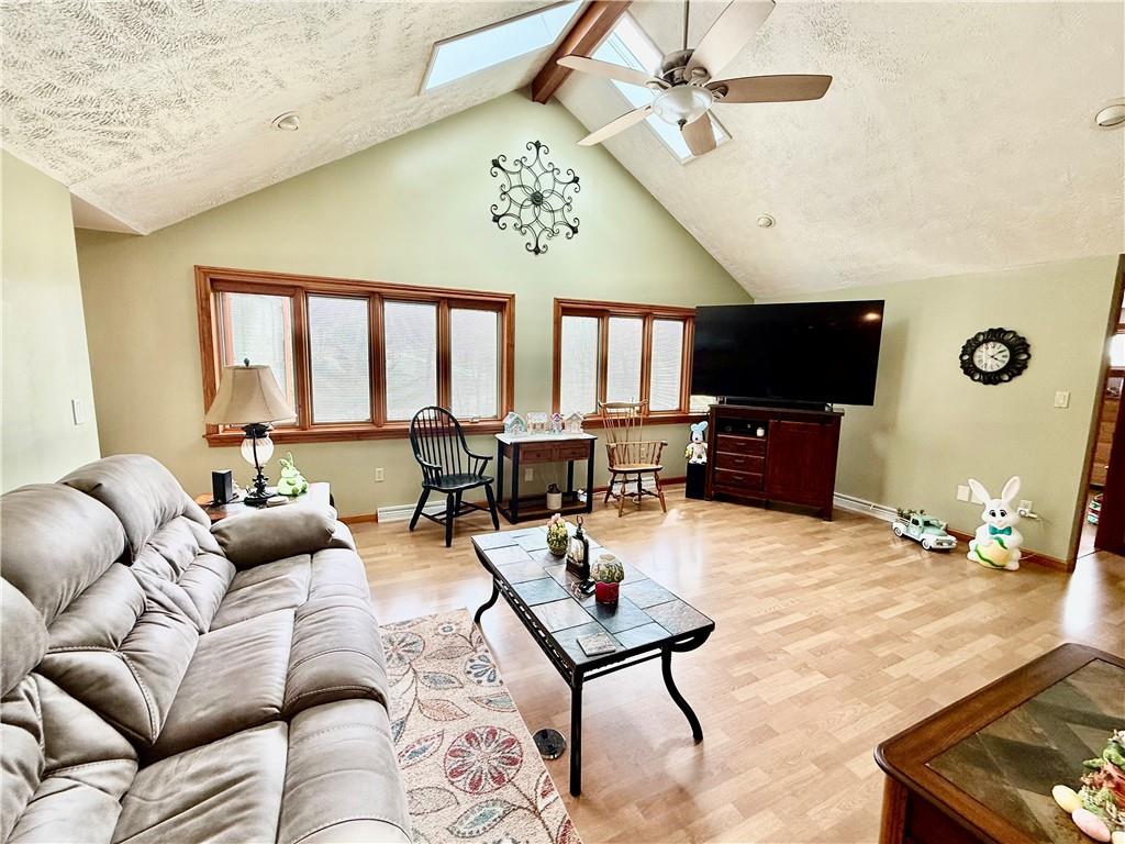 198 Leslie Road Valencia, PA 16059 - Photo 25 of 43 a living room with furniture tv and a window