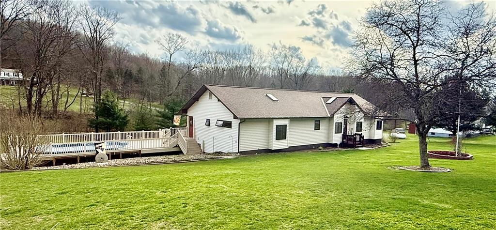 198 Leslie Road Valencia, PA 16059 - Photo 27 of 43 a front view of a house with a garden and trees