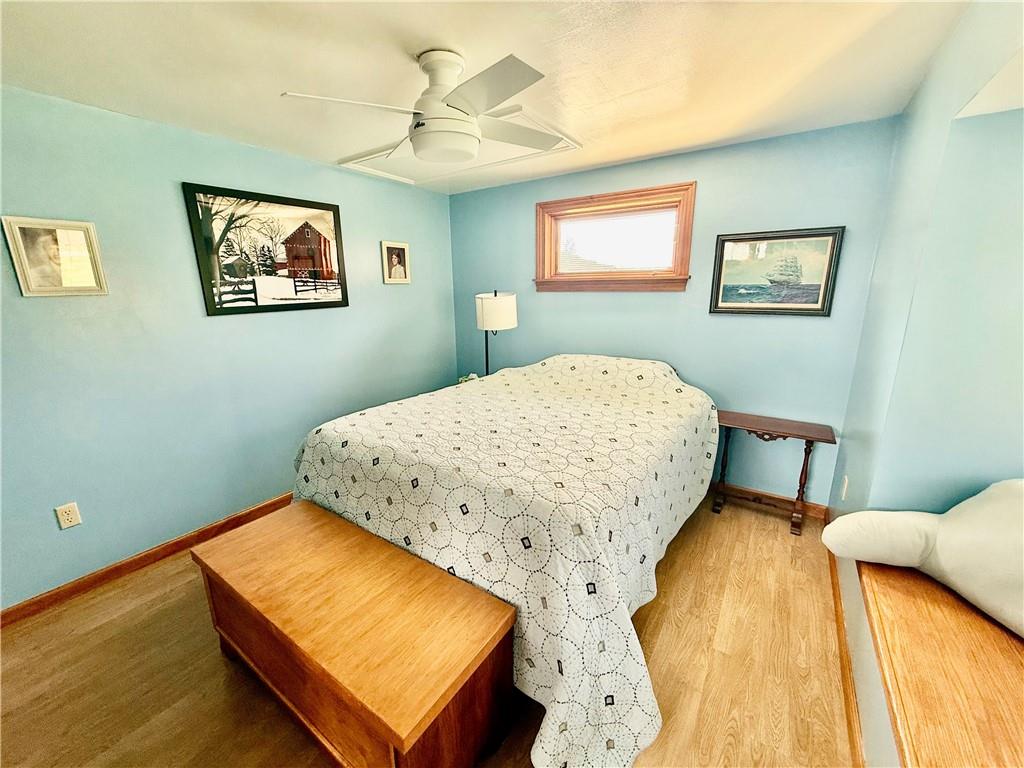 198 Leslie Road Valencia, PA 16059 - Photo 30 of 43 a bedroom with a bed and a lamp on dresser