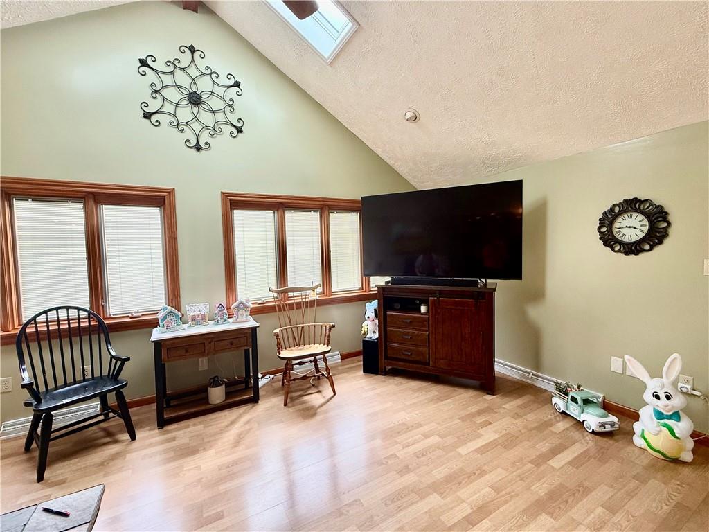 198 Leslie Road Valencia, PA 16059 - Photo 35 of 43 a living room with furniture and a flat screen tv