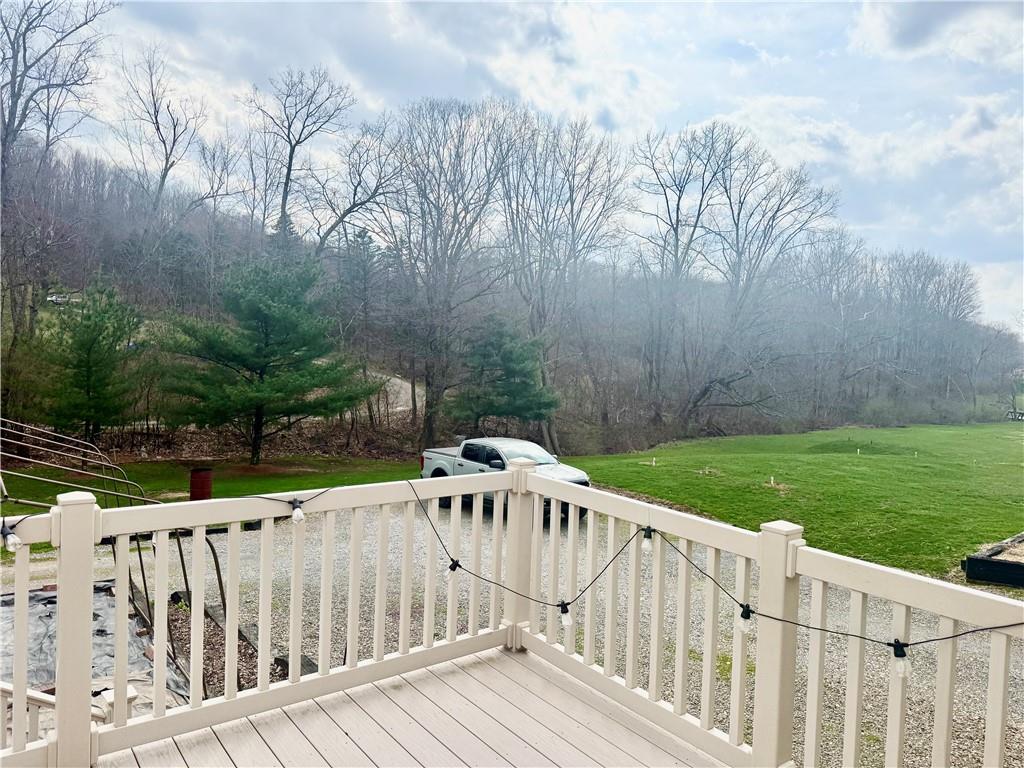 198 Leslie Road Valencia, PA 16059 - Photo 40 of 43 a view of a wooden deck and yard with wooden fence