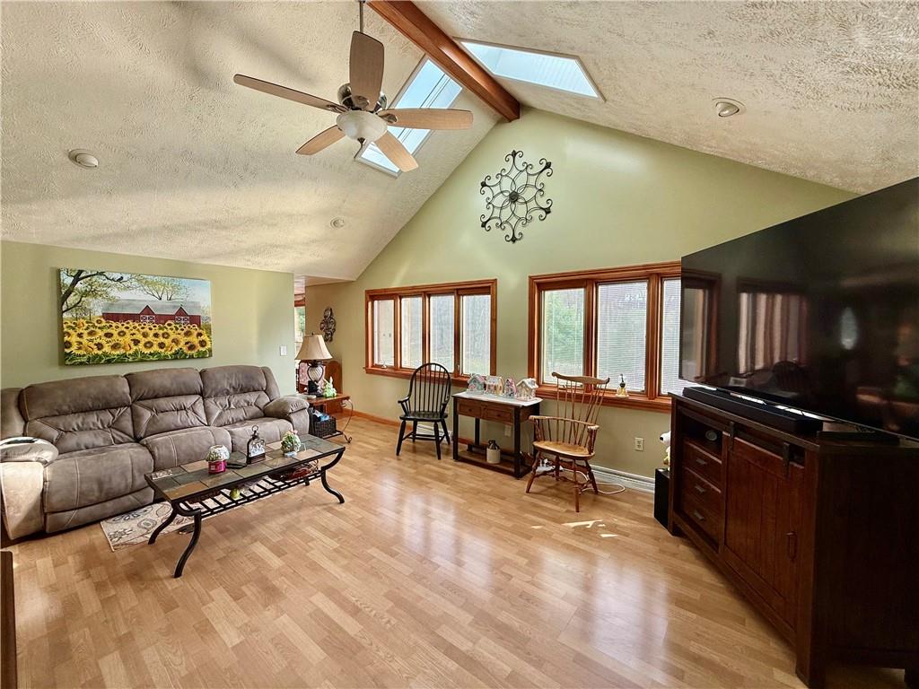 198 Leslie Road Valencia, PA 16059 - Photo 8 of 43 a living room with furniture a rug and a window