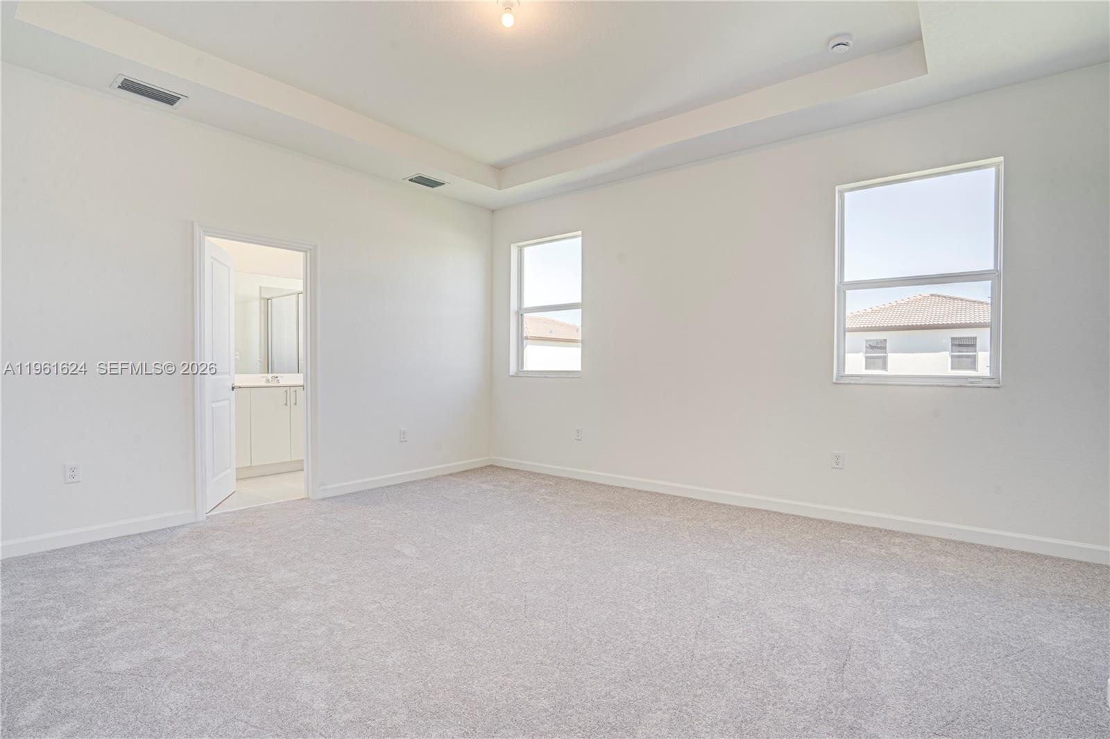 2728 Southeast 24th Court Homestead, FL 33035 - Photo 13 of 18 an empty room with windows