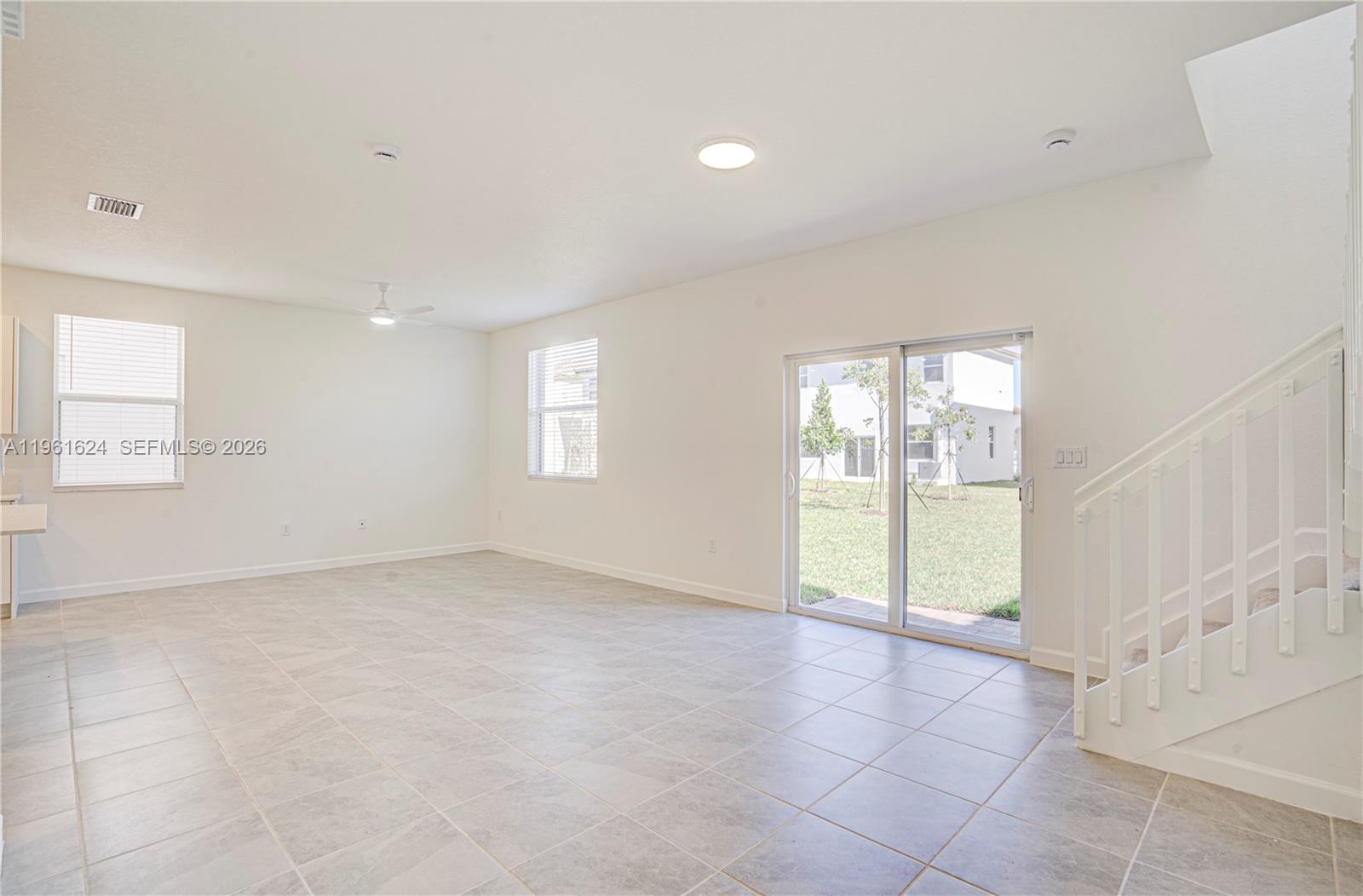 2728 Southeast 24th Court Homestead, FL 33035 - Photo 5 of 18 a view of an empty room with a window