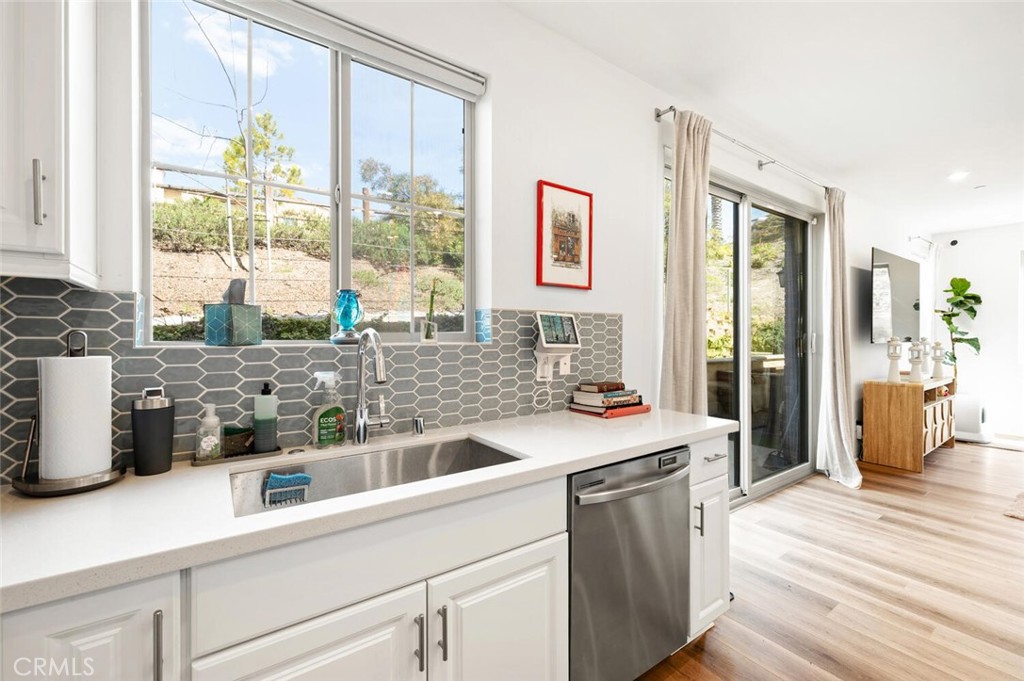 1852 Red Willow Way Oceanside, CA 92056 - Photo 12 of 52 a kitchen with stainless steel appliances granite countertop a stove a sink and a refrigerator