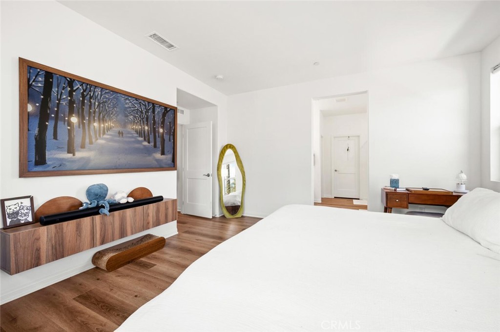1852 Red Willow Way Oceanside, CA 92056 - Photo 16 of 52 a bedroom with a bed and painting on the wall