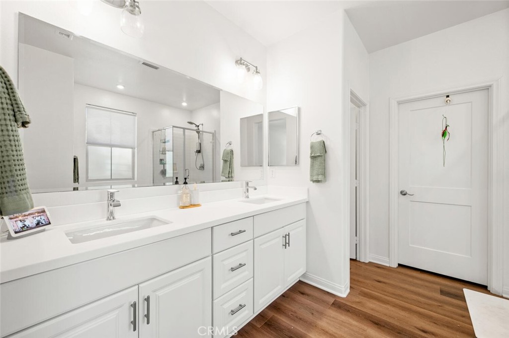 1852 Red Willow Way Oceanside, CA 92056 - Photo 19 of 52 a spacious bathroom with double sink and a mirror