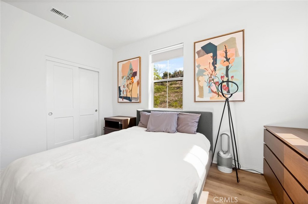 1852 Red Willow Way Oceanside, CA 92056 - Photo 23 of 52 a bedroom with a large bed and a window