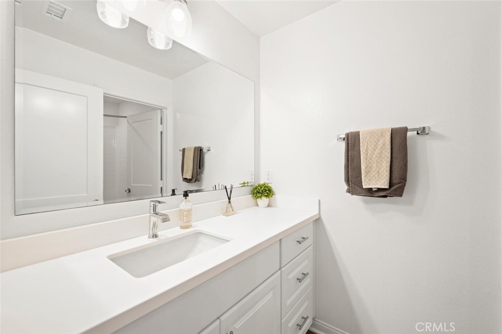 1852 Red Willow Way Oceanside, CA 92056 - Photo 26 of 52 a bathroom with a sink and a mirror