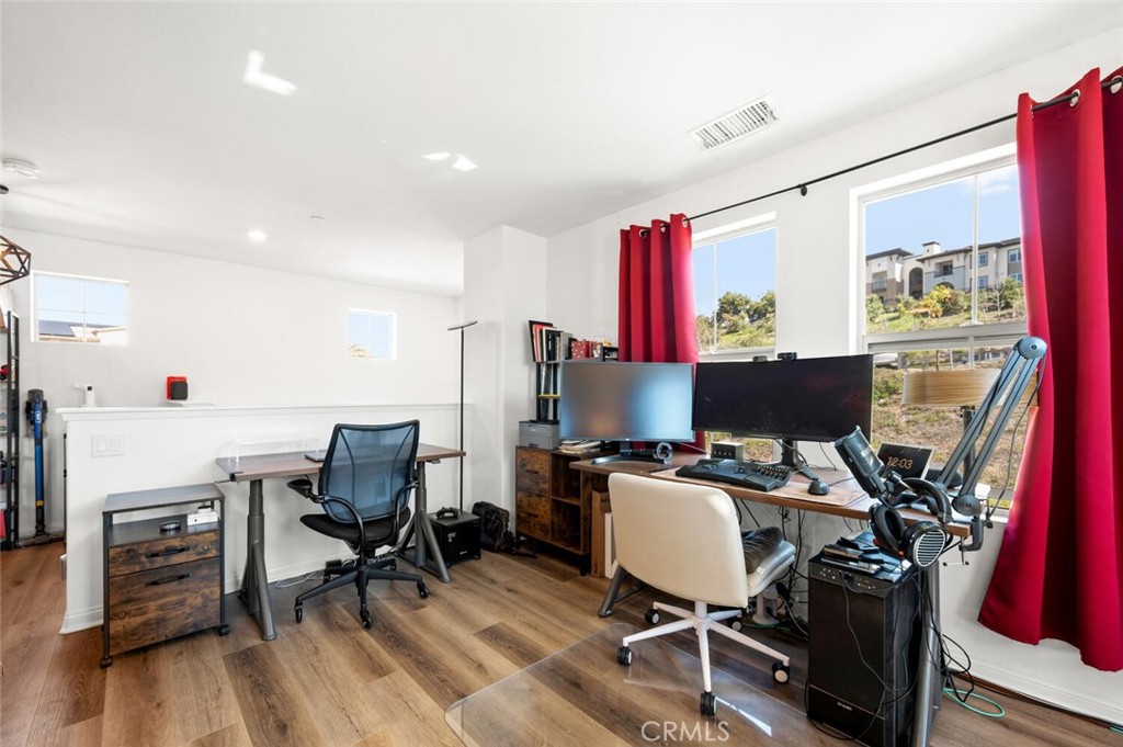 1852 Red Willow Way Oceanside, CA 92056 - Photo 32 of 52 a workspace with furniture and wooden floor