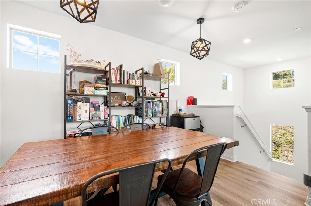 1852 Red Willow Way Oceanside, CA 92056 - Photo 35 of 52 a view of a dining room with furniture and wooden floor