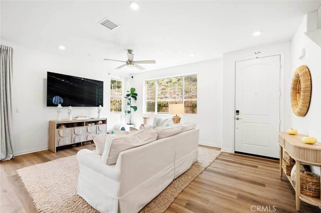 1852 Red Willow Way Oceanside, CA 92056 - Photo 4 of 52 a living room with furniture a flat screen tv and a window