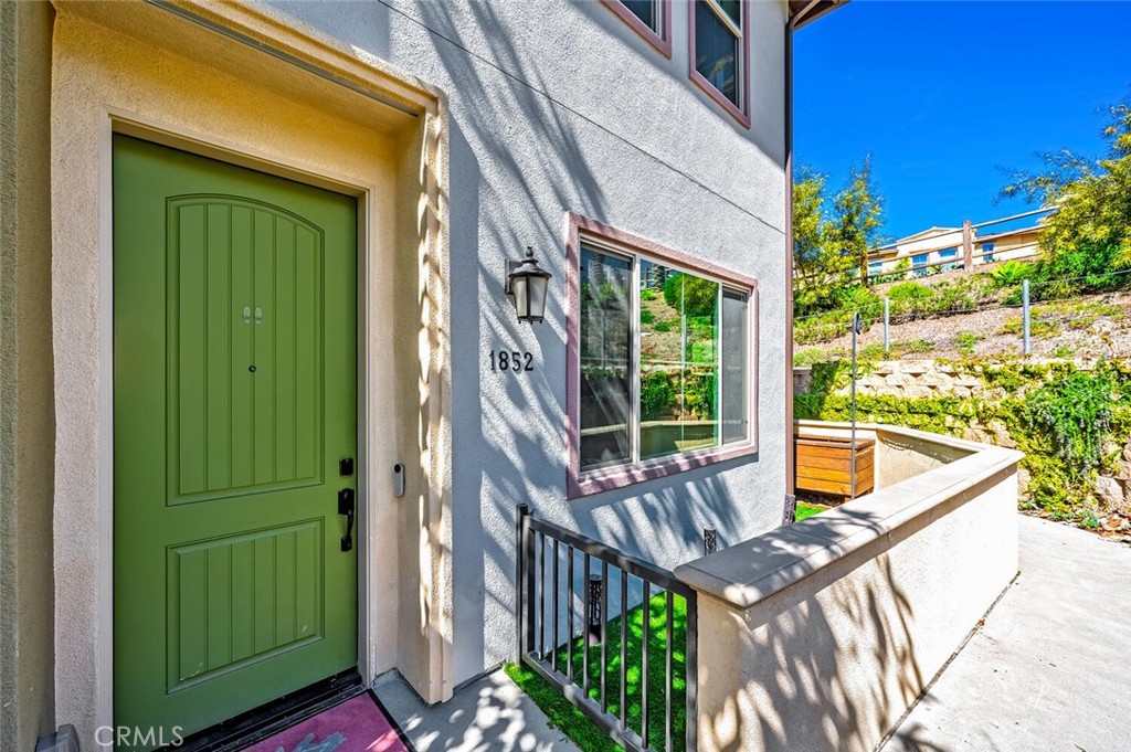 1852 Red Willow Way Oceanside, CA 92056 - Photo 44 of 52 a view of a house with a large window and wooden fence