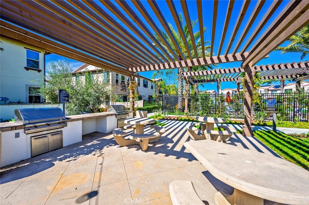 1852 Red Willow Way Oceanside, CA 92056 - Photo 47 of 52 a view of a patio with a table chairs and a backyard