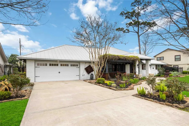 a view of house with outdoor space and sitting area