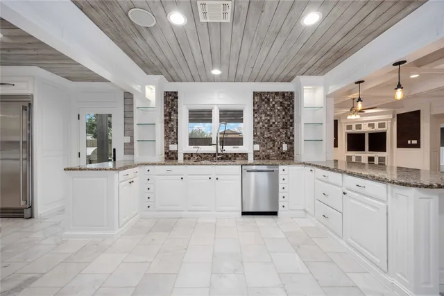 a view of a hallway with washer and dryer