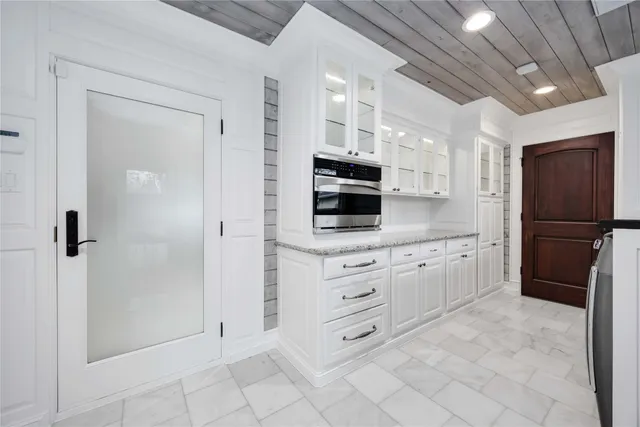 a bathroom with a granite countertop sink mirror and vanity