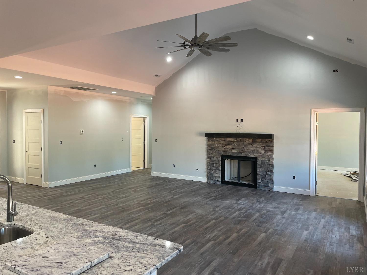 1075 Everett Road Forest, VA 24551 - Photo 5 of 12 a view of an empty room with a fireplace and a window