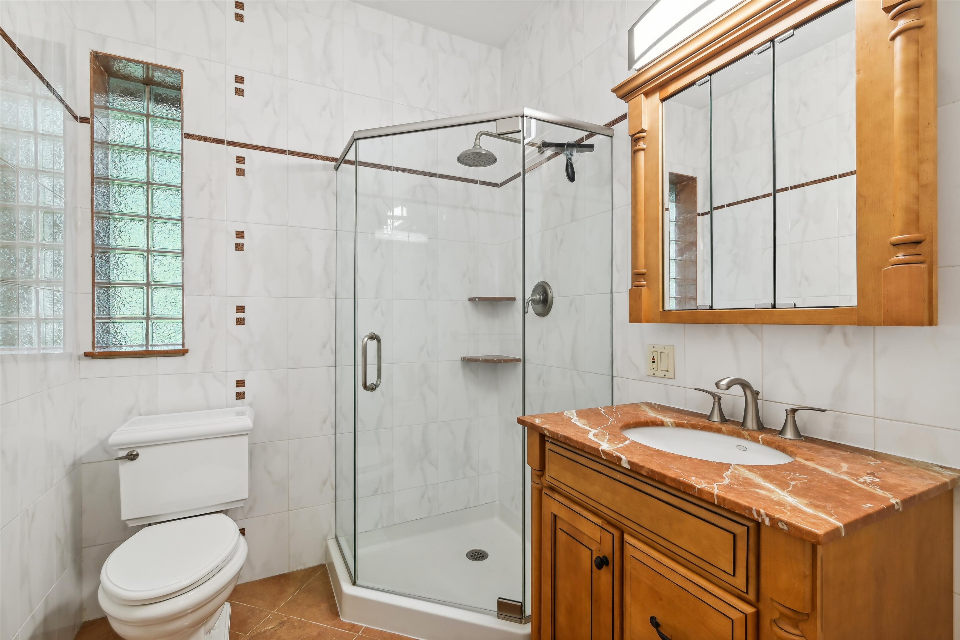 8 Carroll Place Weehawken, NJ 07086 - Photo 11 of 21 a bathroom with a sink a toilet and shower