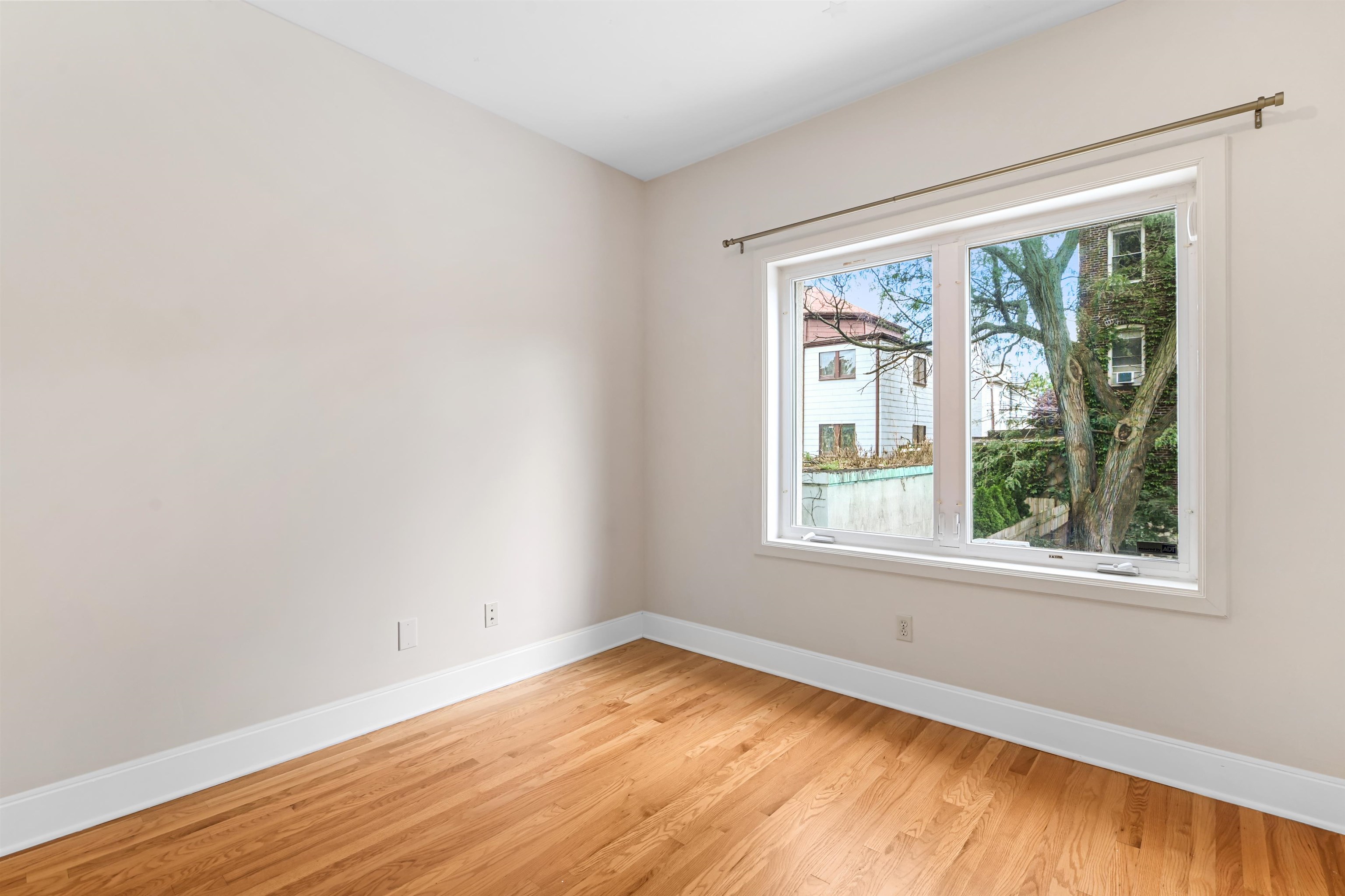 8 Carroll Place Weehawken, NJ 07086 - Photo 12 of 21 a view of empty room with wooden floor and fan