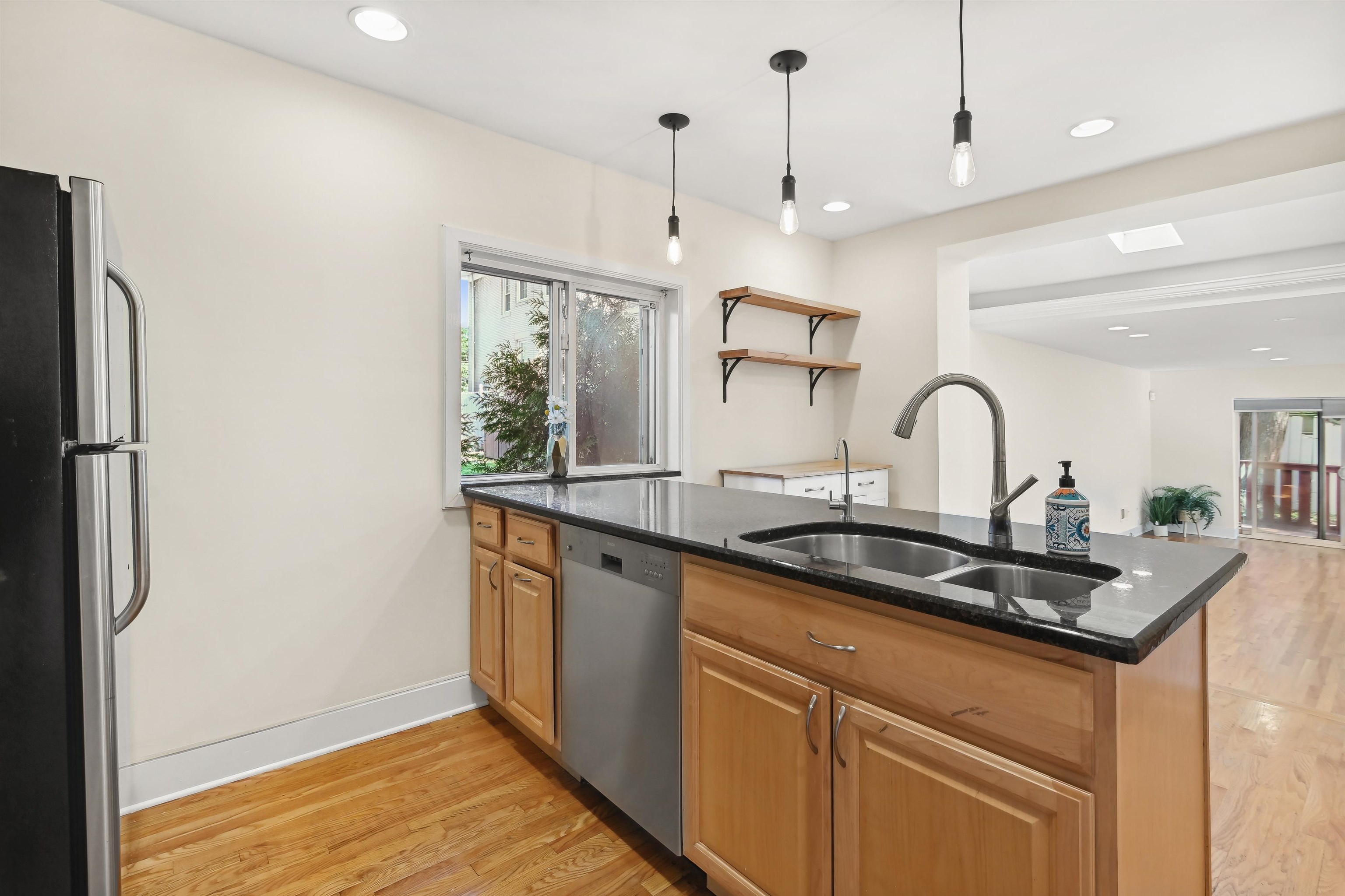 8 Carroll Place Weehawken, NJ 07086 - Photo 17 of 21 a kitchen with stainless steel appliances granite countertop a sink stove and refrigerator