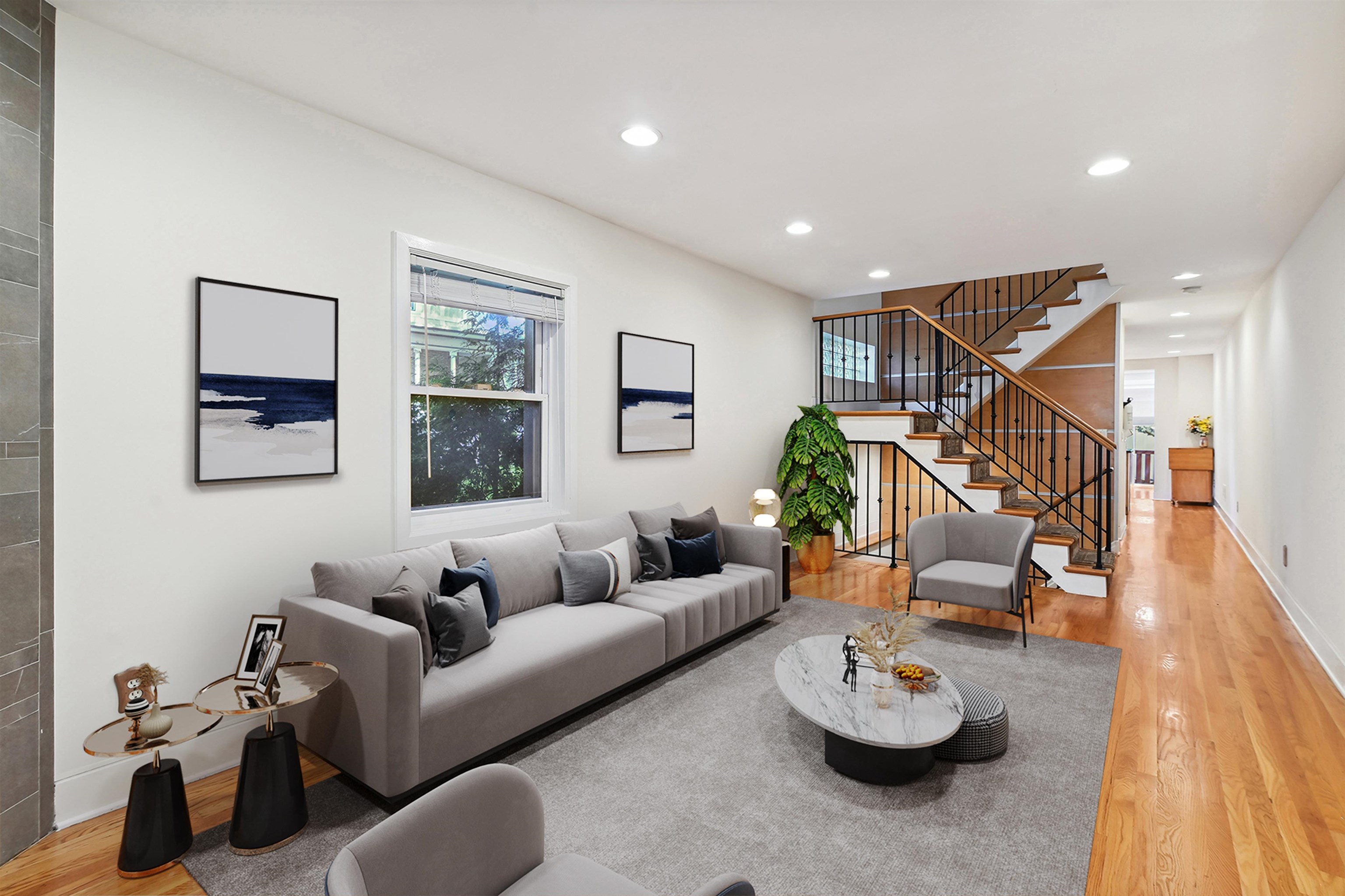 8 Carroll Place Weehawken, NJ 07086 - Photo 2 of 21 a living room with furniture and a wooden floor