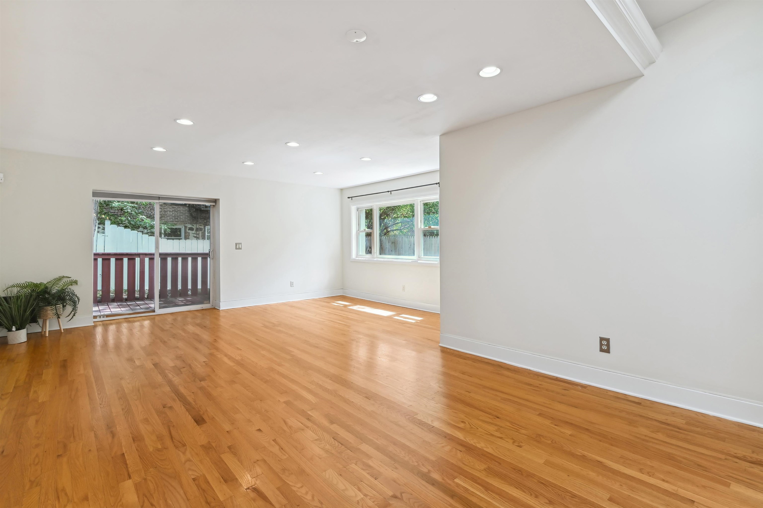 8 Carroll Place Weehawken, NJ 07086 - Photo 7 of 21 an empty room with wooden floor and windows
