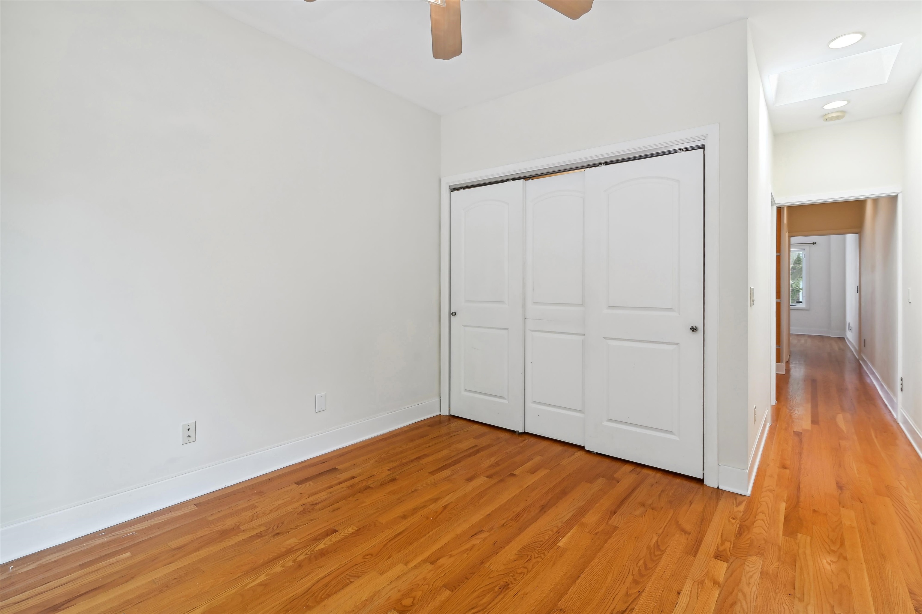 8 Carroll Place Weehawken, NJ 07086 - Photo 9 of 21 a view of an empty room with wooden floor