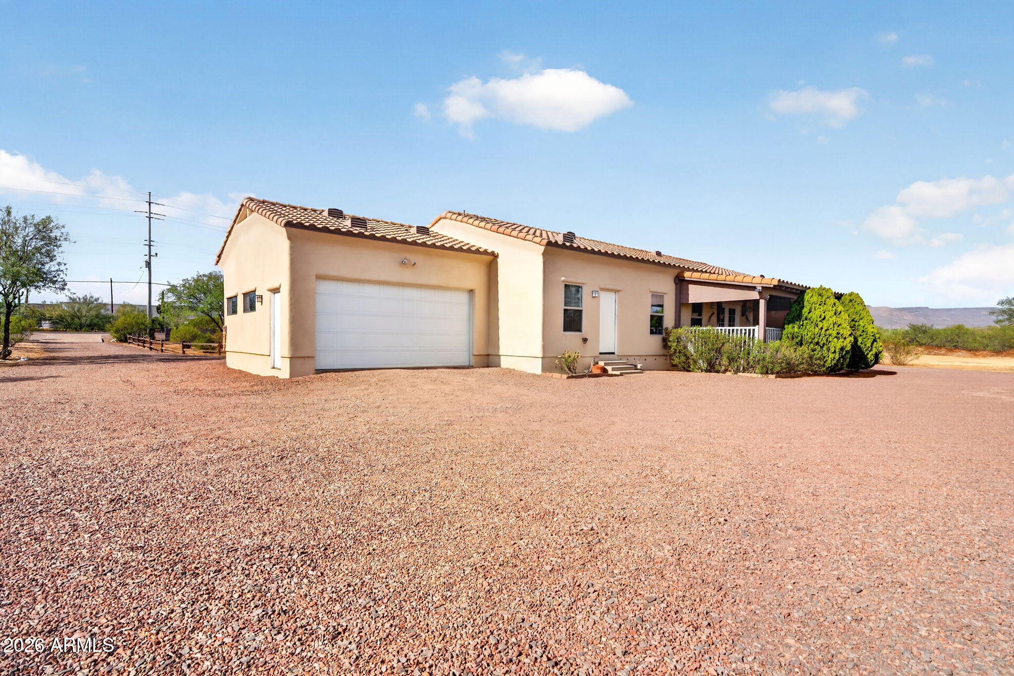 2929 West New River Road New River, AZ 85087 - Photo 39 of 53 a front view of a house with a yard and garage