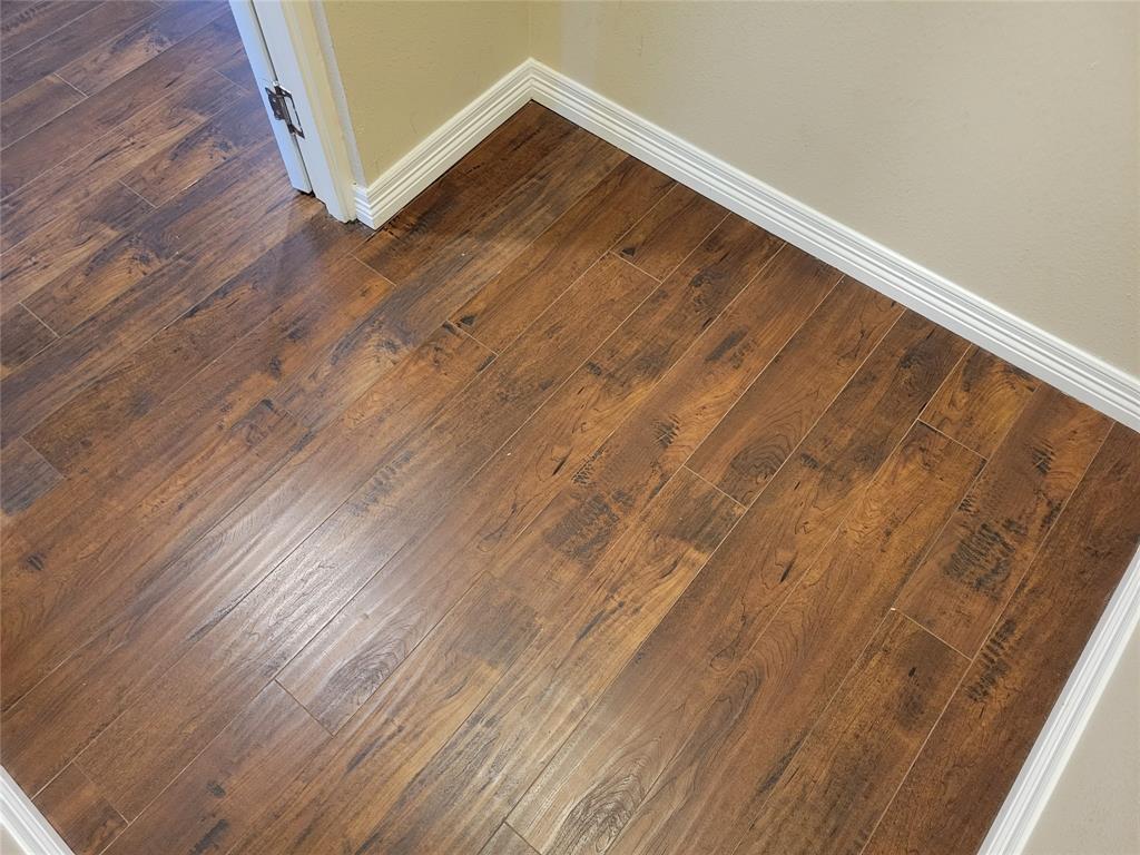 1100 Trinity Mills, Unit 2005 Carrollton, TX 75006 - Photo 13 of 18 a view of room with wooden floor