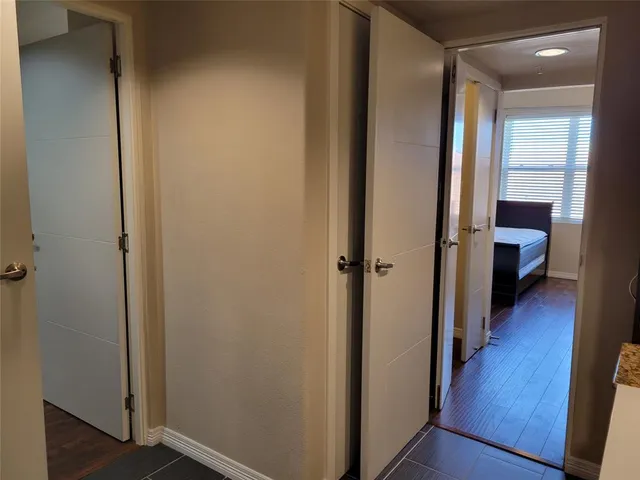 a view of a hallway with the wooden floor