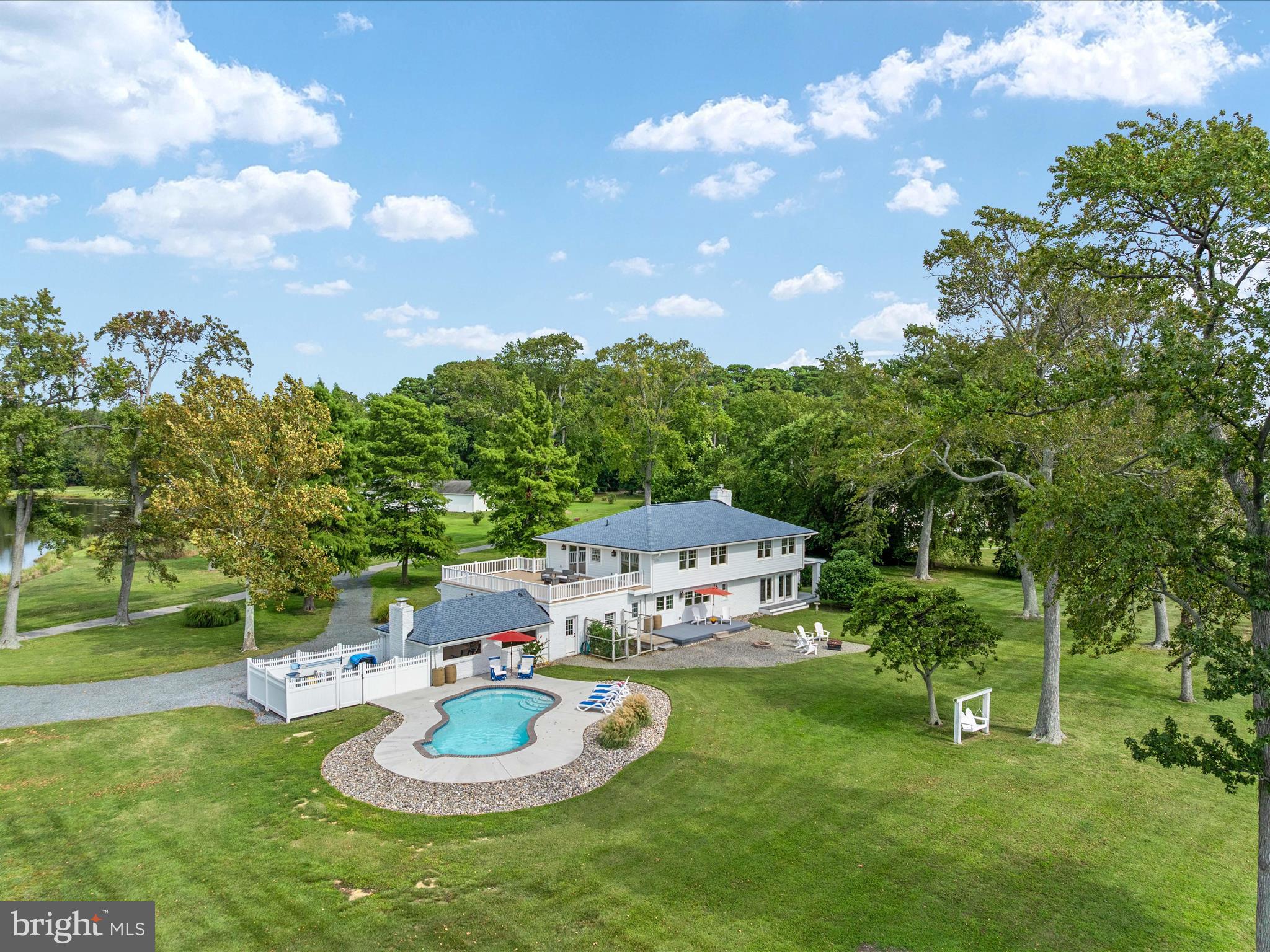 133 Kilby Point Queenstown, MD 21658 - Photo 14 of 87 a backyard of a house with table and chairs