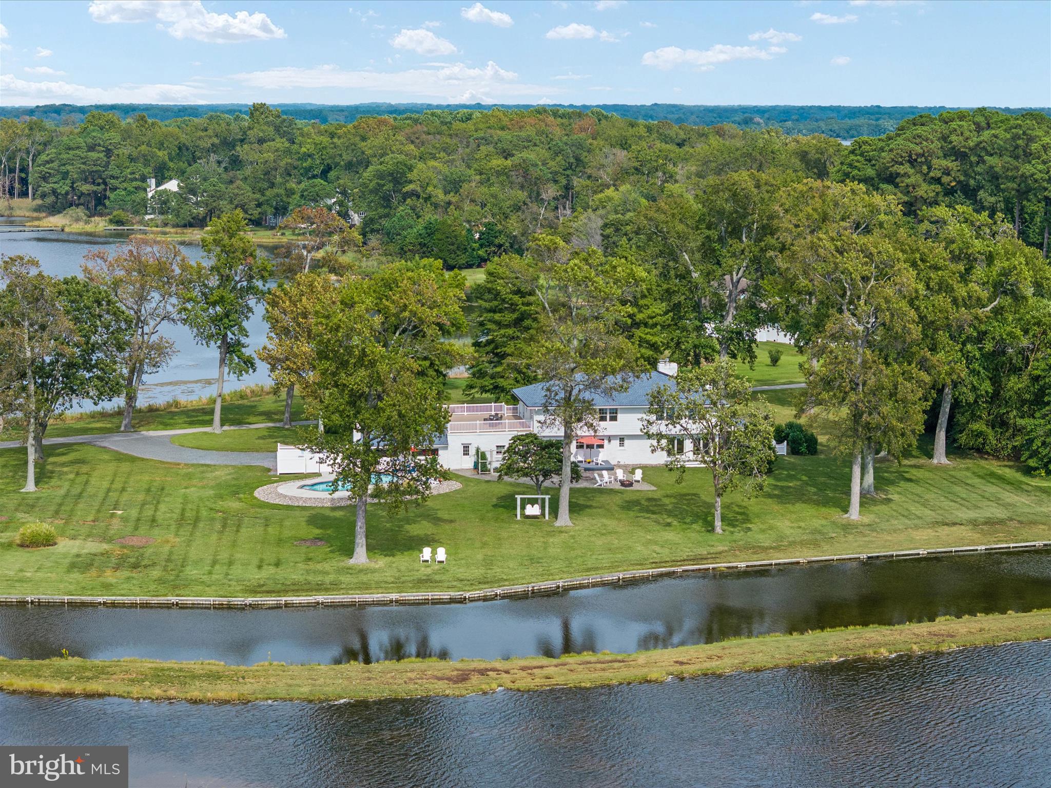 133 Kilby Point Queenstown, MD 21658 - Photo 16 of 87 a view of a lake with a building in the background