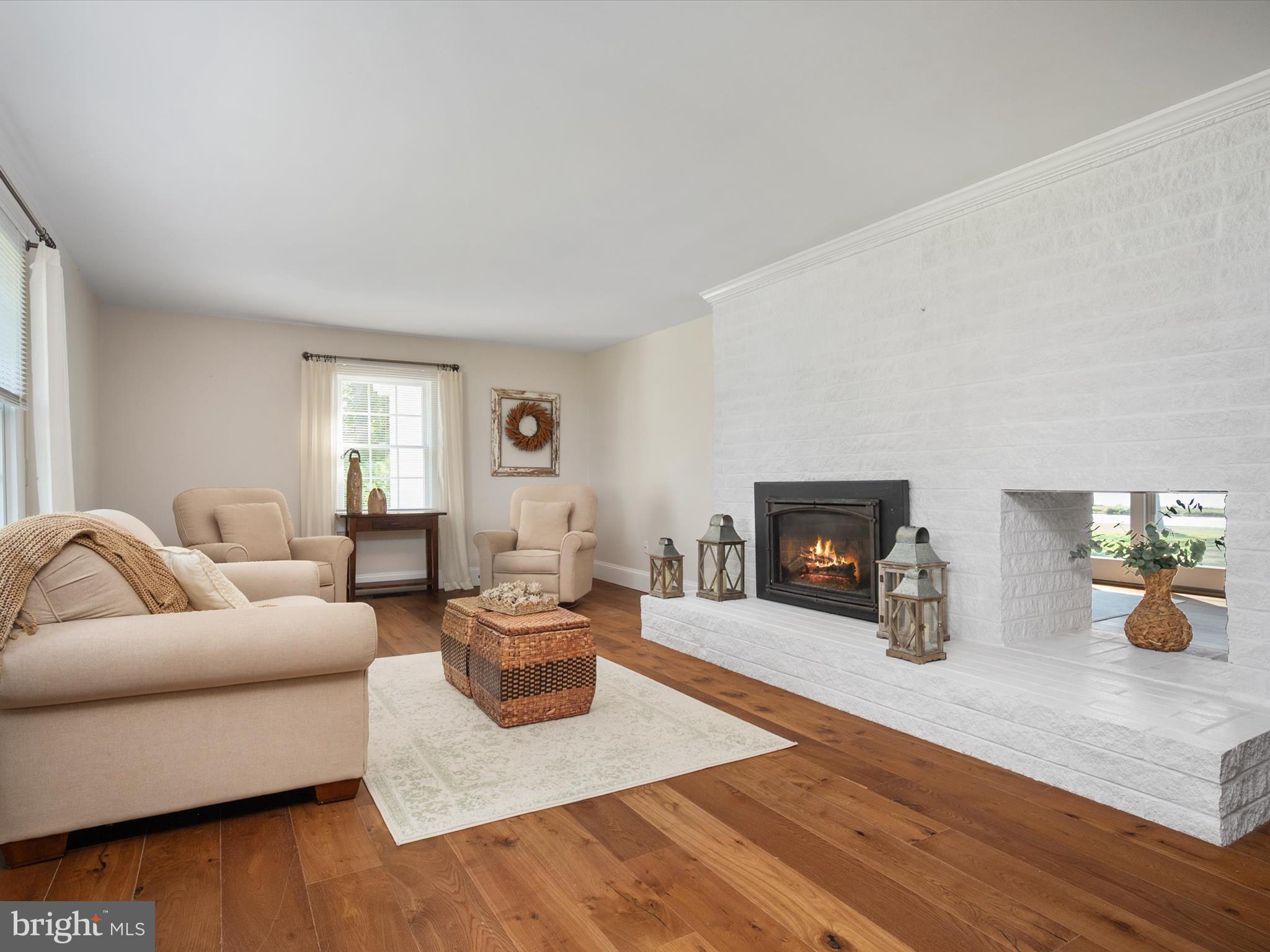 133 Kilby Point Queenstown, MD 21658 - Photo 25 of 87 a living room with furniture and a fireplace