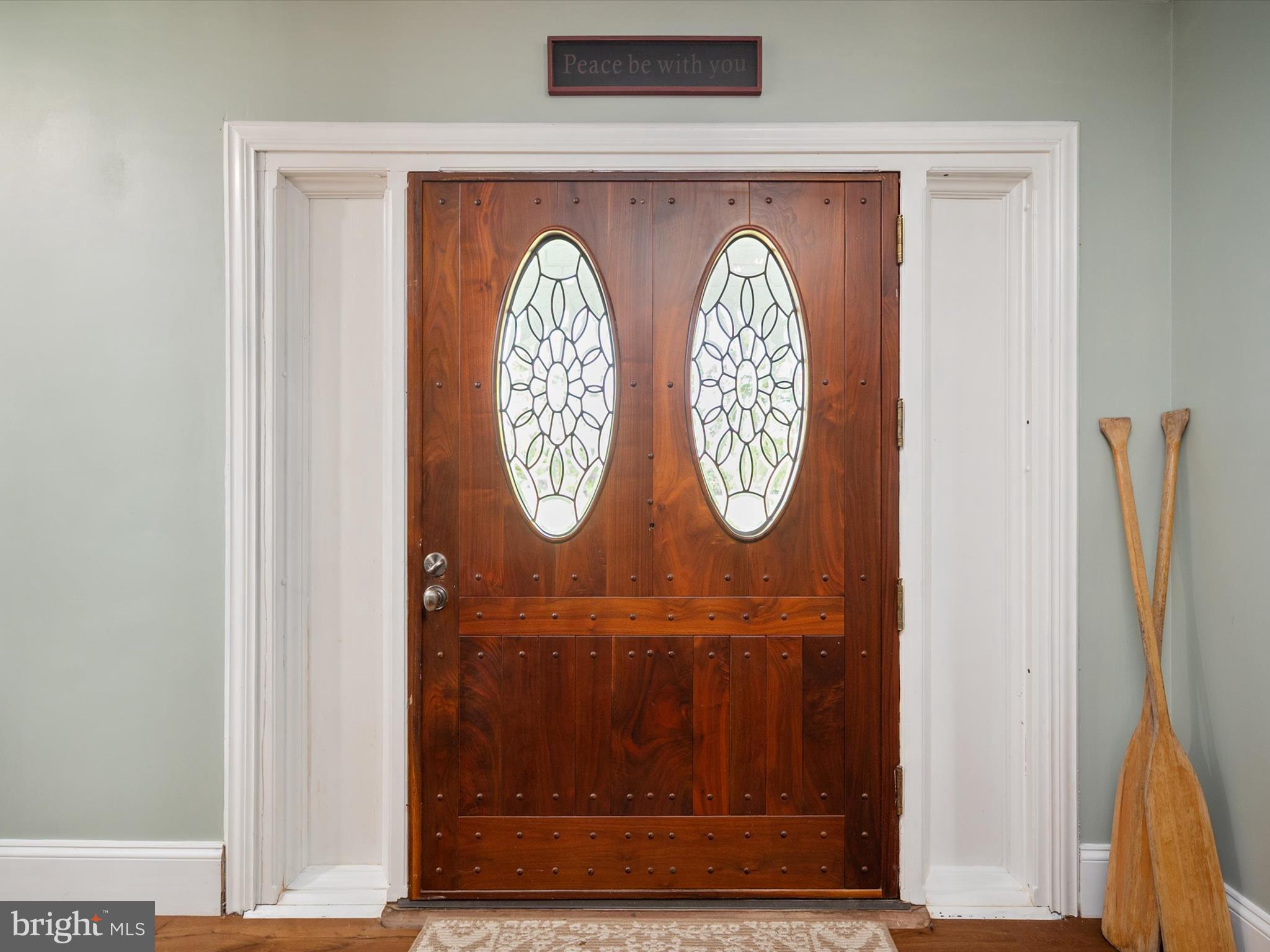 133 Kilby Point Queenstown, MD 21658 - Photo 28 of 87 a wooden door with a clock on it