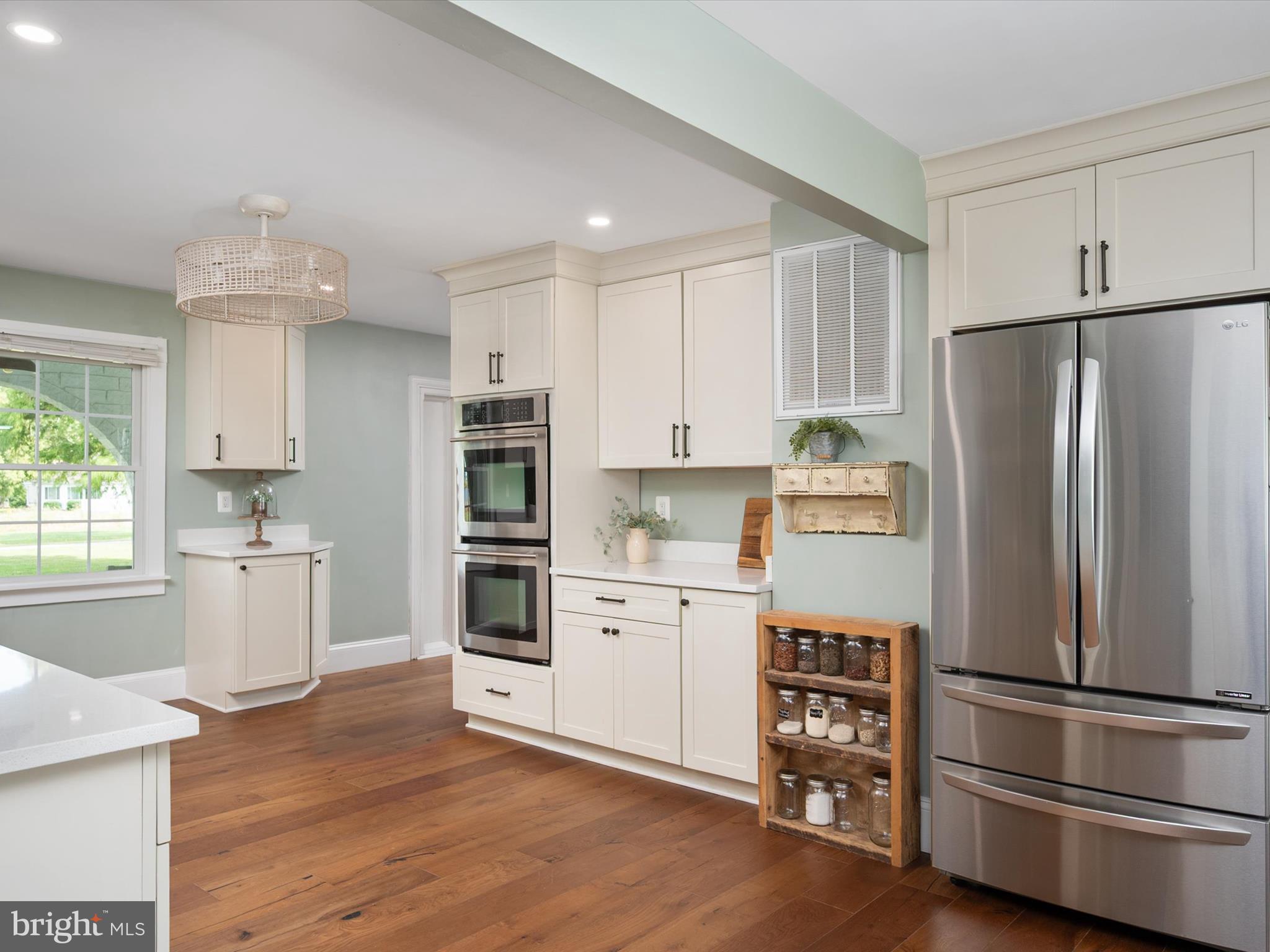 133 Kilby Point Queenstown, MD 21658 - Photo 37 of 87 a kitchen with white cabinets and stainless steel appliances