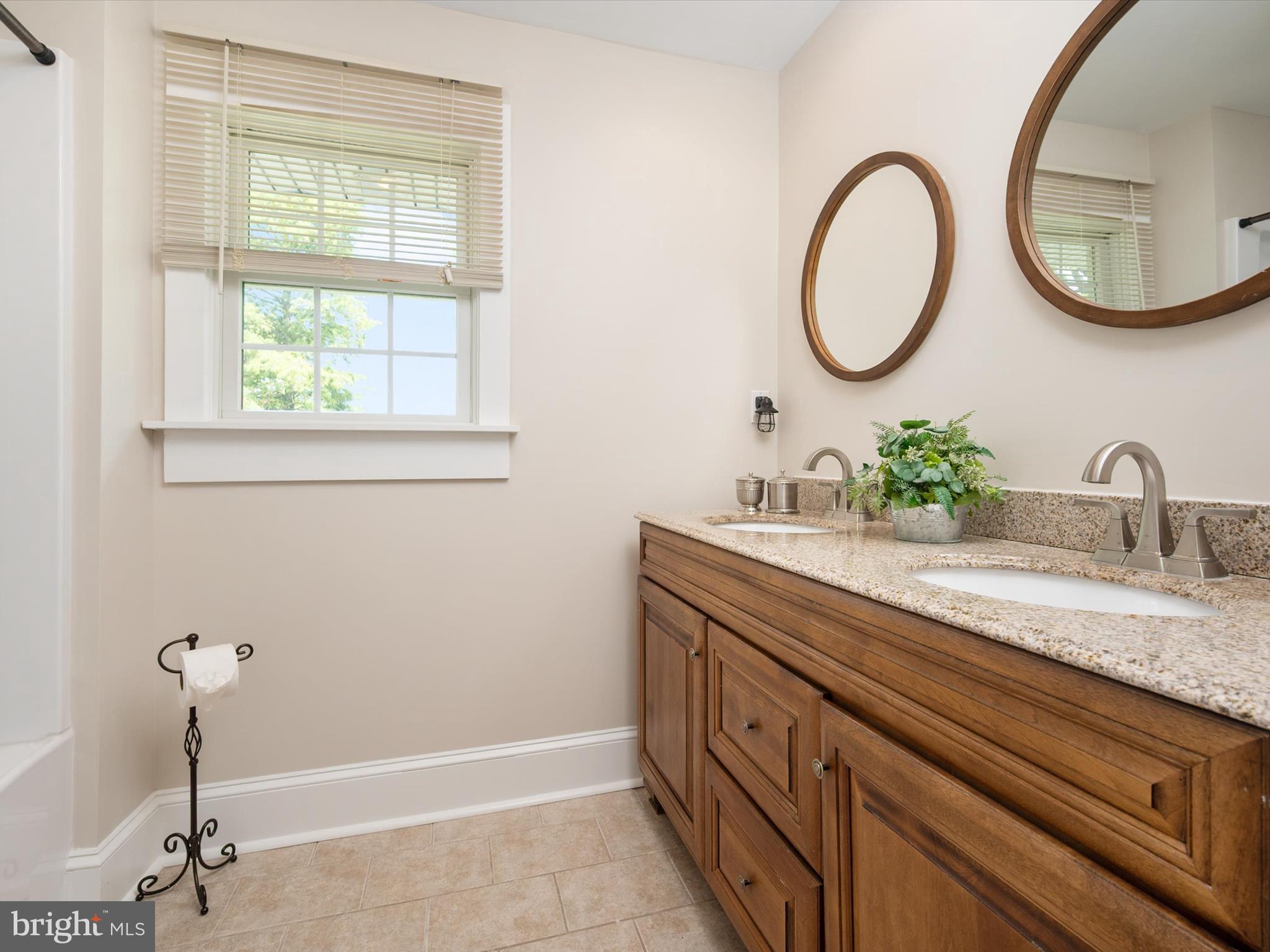 133 Kilby Point Queenstown, MD 21658 - Photo 46 of 87 a bathroom with a granite countertop sink and a mirror