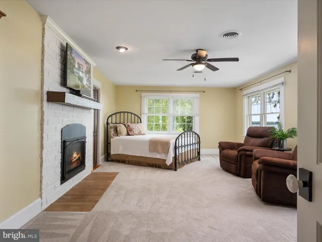 a view of a swimming pool with an outdoor space and seating area