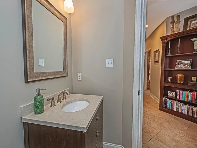 a bathroom with a sink and a mirror