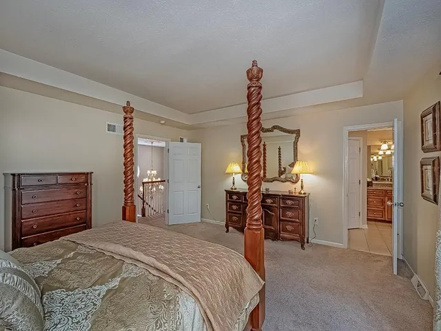 a bedroom with a bed and furniture