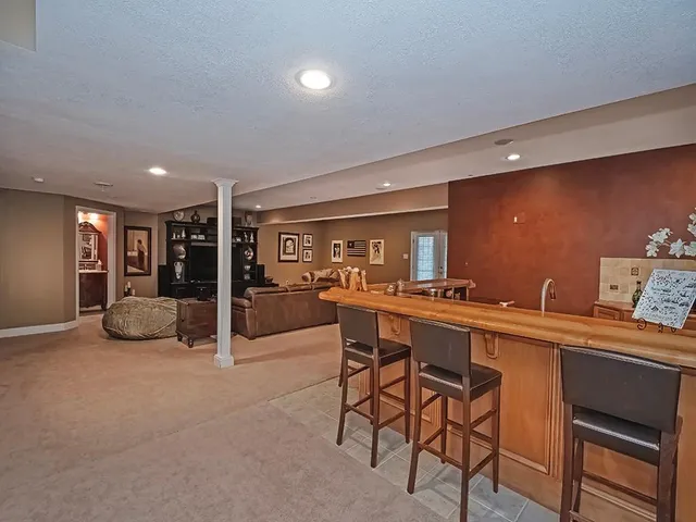 a kitchen with a table and chairs in it