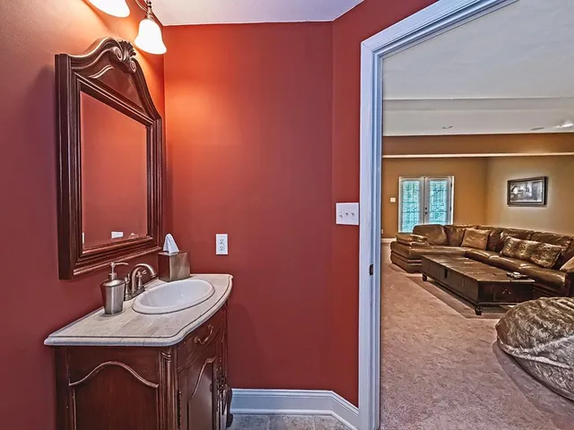 a kitchen with a sink and a stove top oven