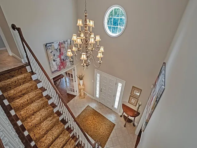 a view of entryway with a chandelier