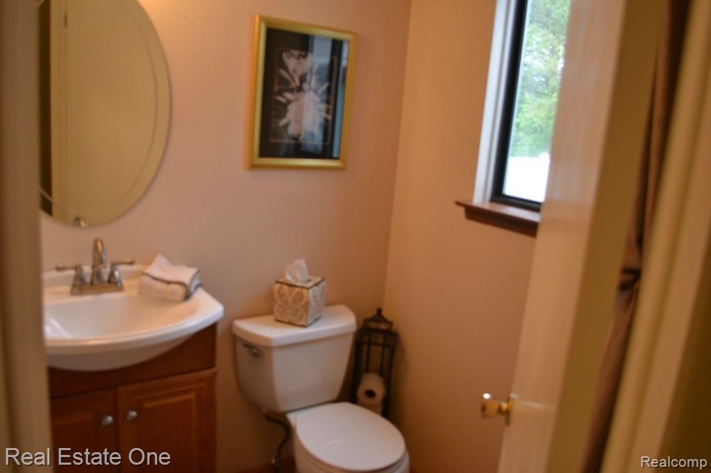 716 Dressler Lane Rochester, MI 48307 - Photo 10 of 17 Updated half bath with new sink/cabinet and tile