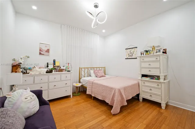 a bedroom with a bed and a cabinets