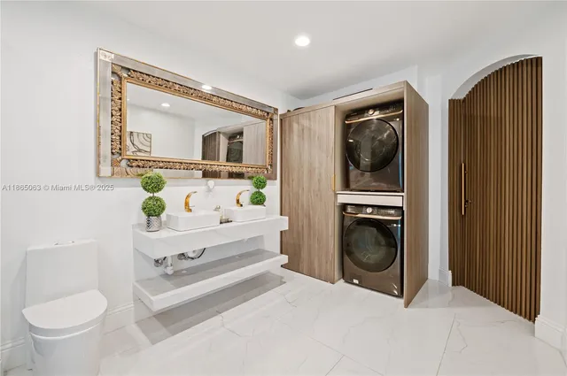 a bathroom with a sink a toilet and a mirror