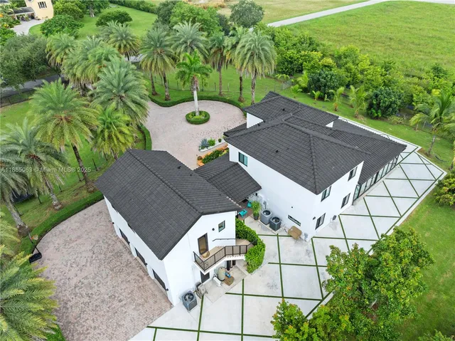 an aerial view of a house with outdoor space