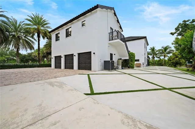 a house with palm tree in front of it