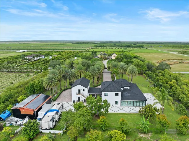 an aerial view of a house with a garden