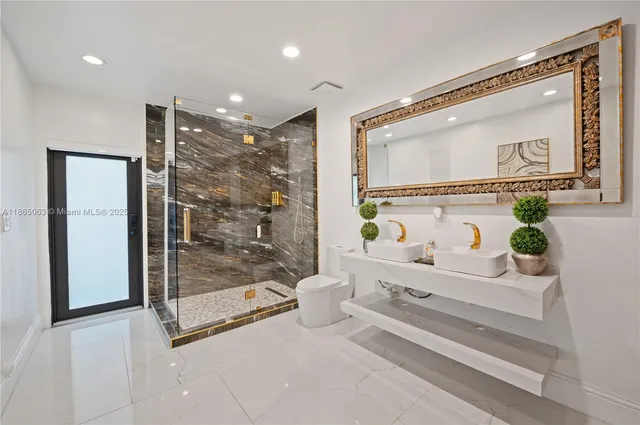 a bathroom with a shower a mirror and a shower